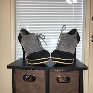 Black and gray stiletto pumps.